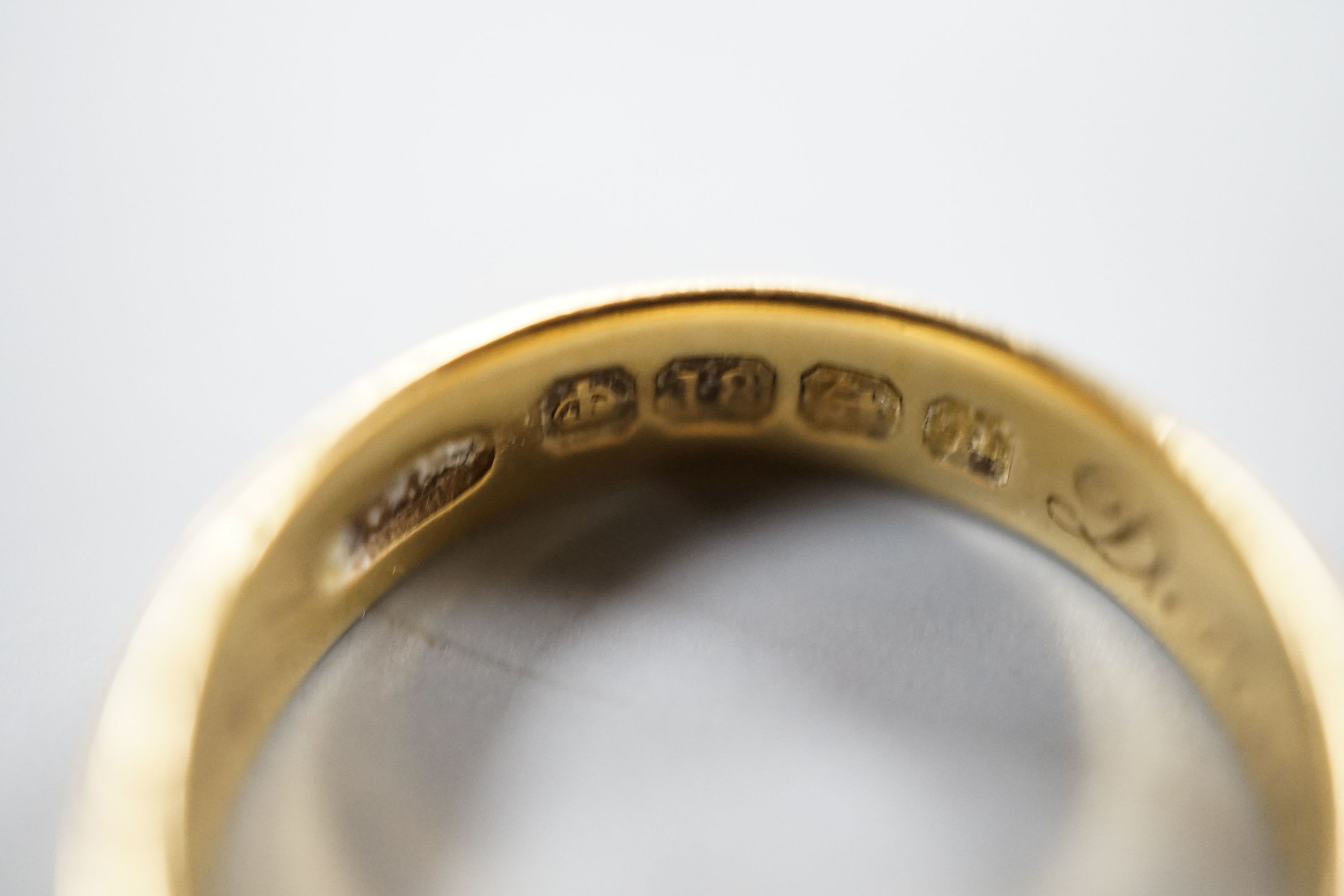 Two 22ct gold wedding bands, 10.3 grams, a George V 18ct gold wedding band and a Victorian 18ct gold shank, 6.6 grams.